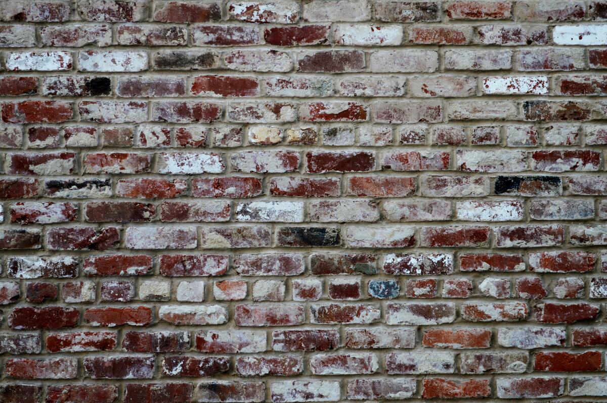 A wall of scuffed bricks