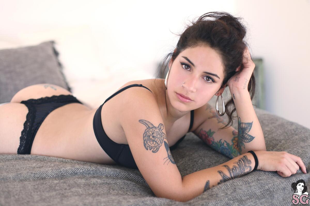 Girl in black underwear and body tattoos