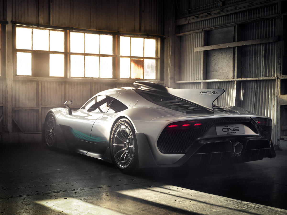 Mercedes amg project one stands in an abandoned garage.