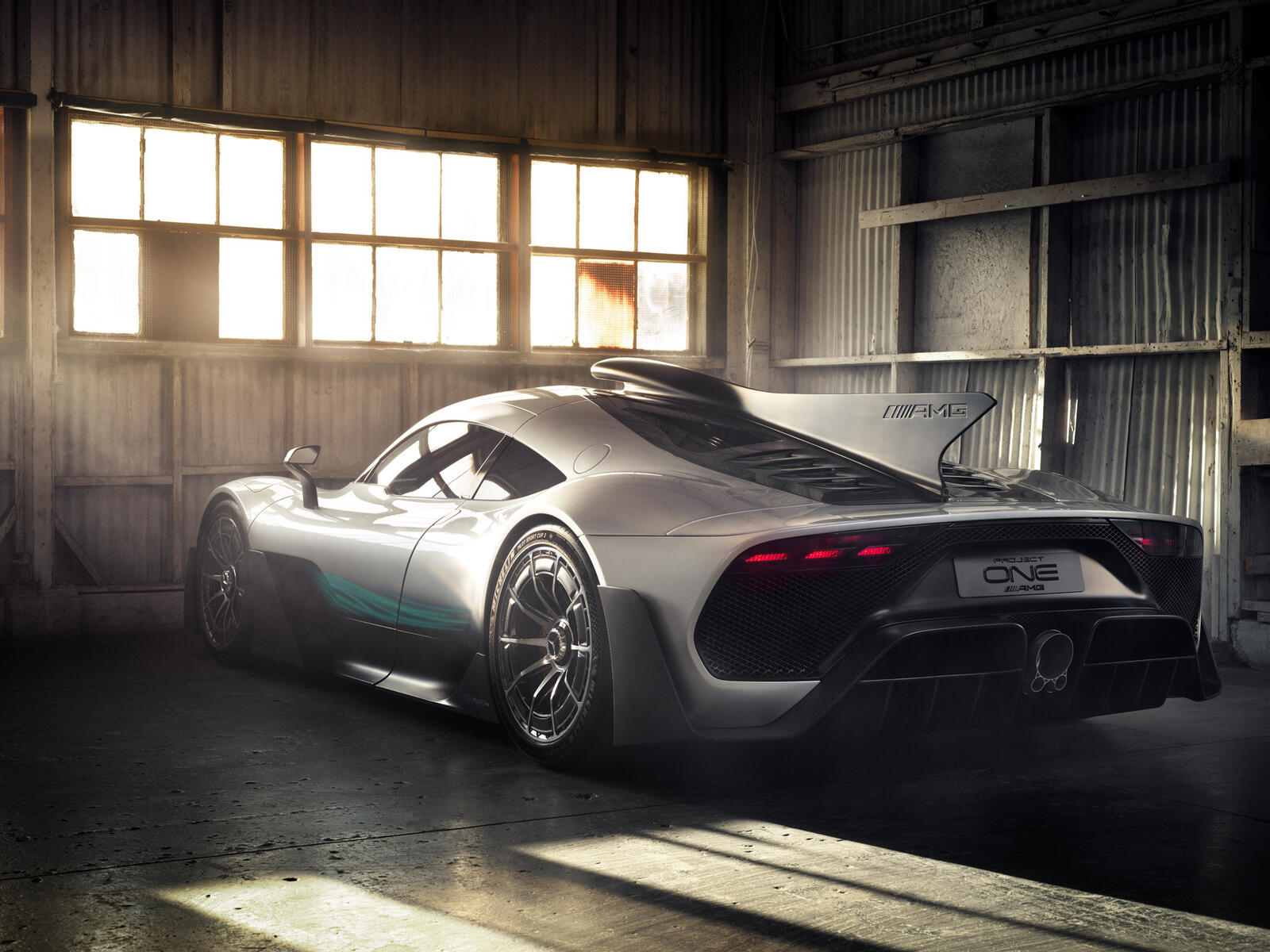 Free photo Mercedes amg project one stands in an abandoned garage.
