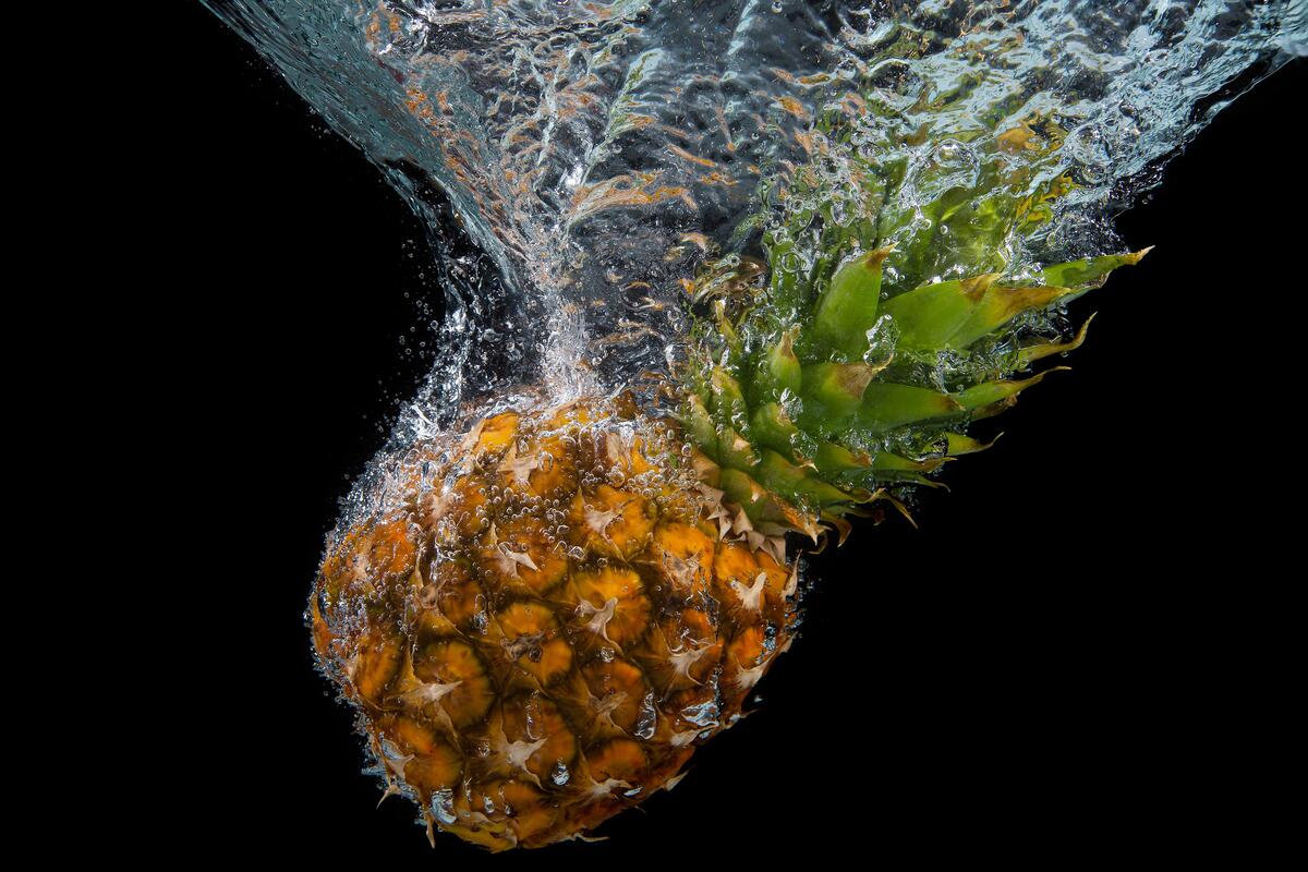 The pineapple fell into the water