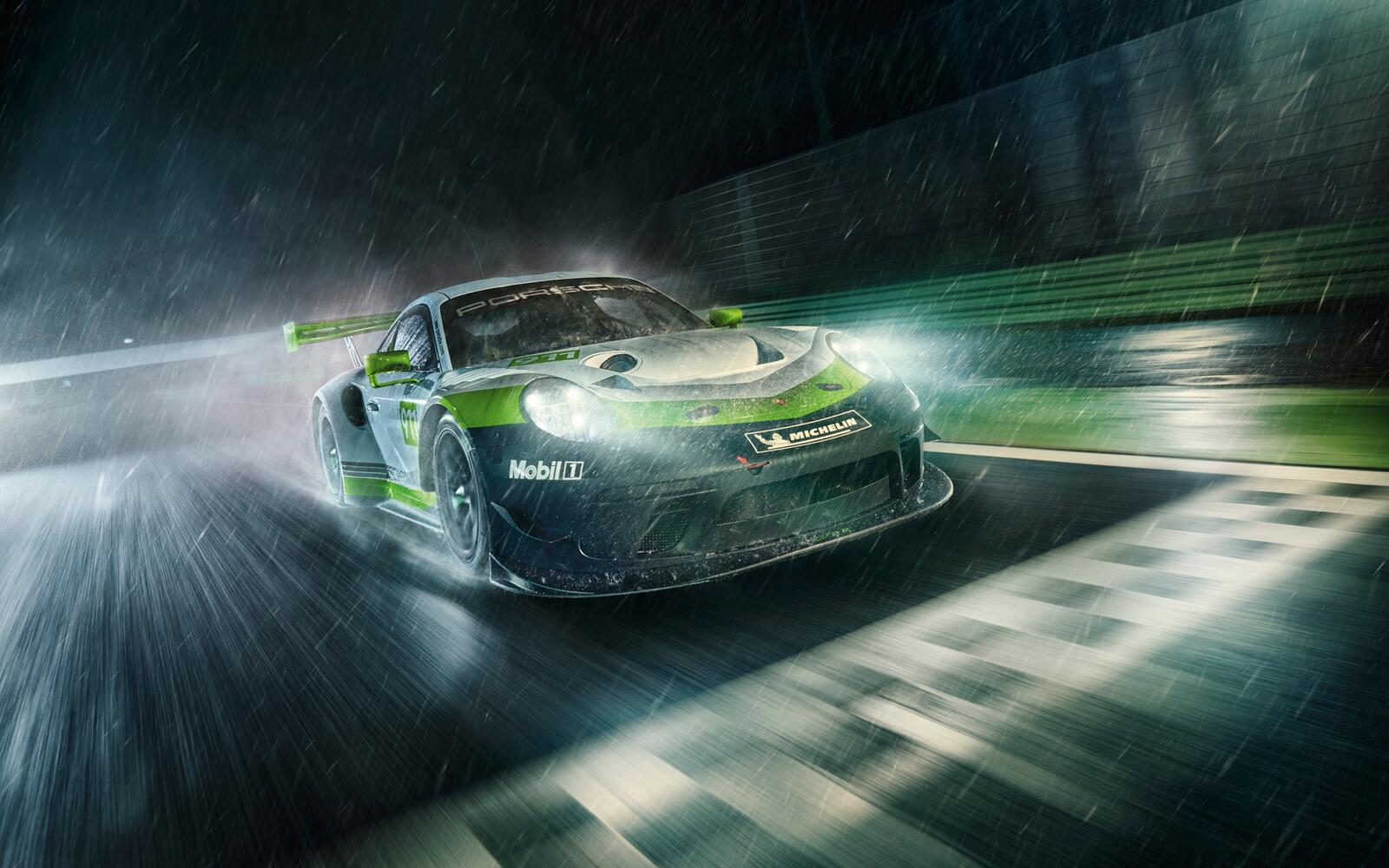 Free photo The Porsche 911 Gt3 R drives on a rainy road at night.