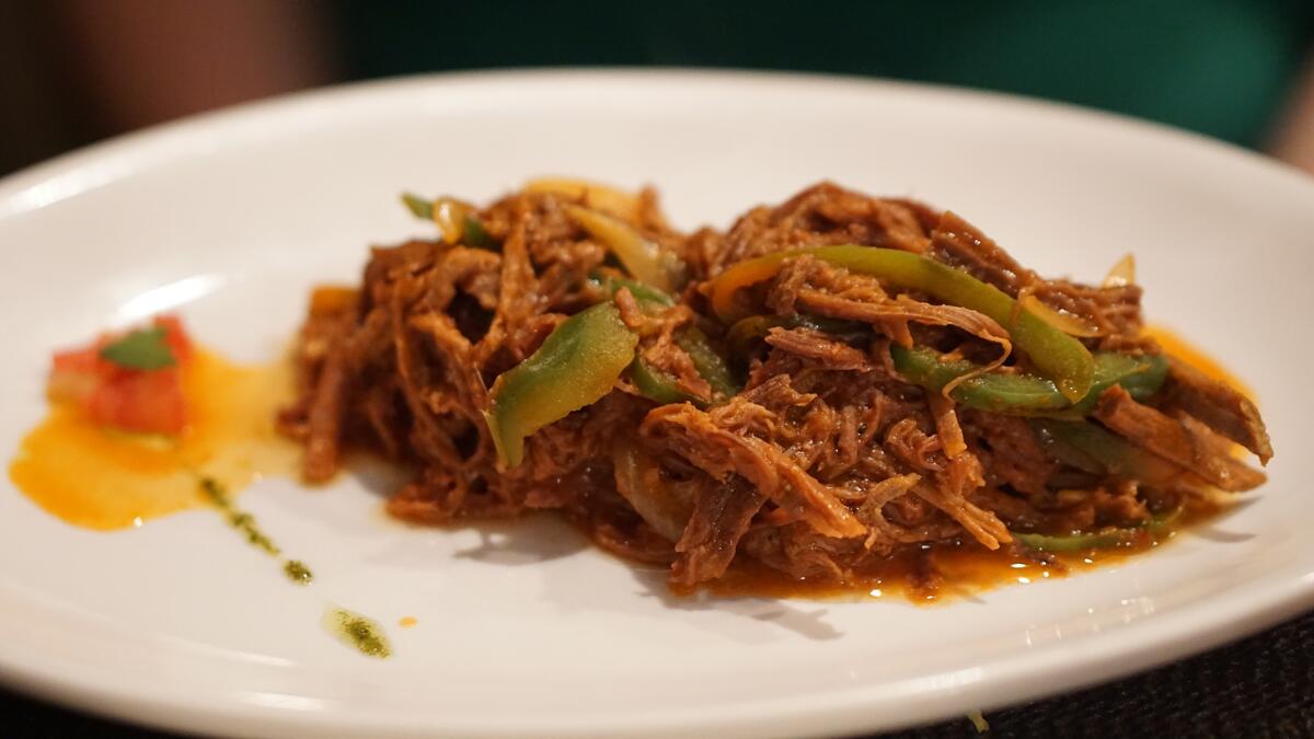 Braised cabbage and beef on a white plate
