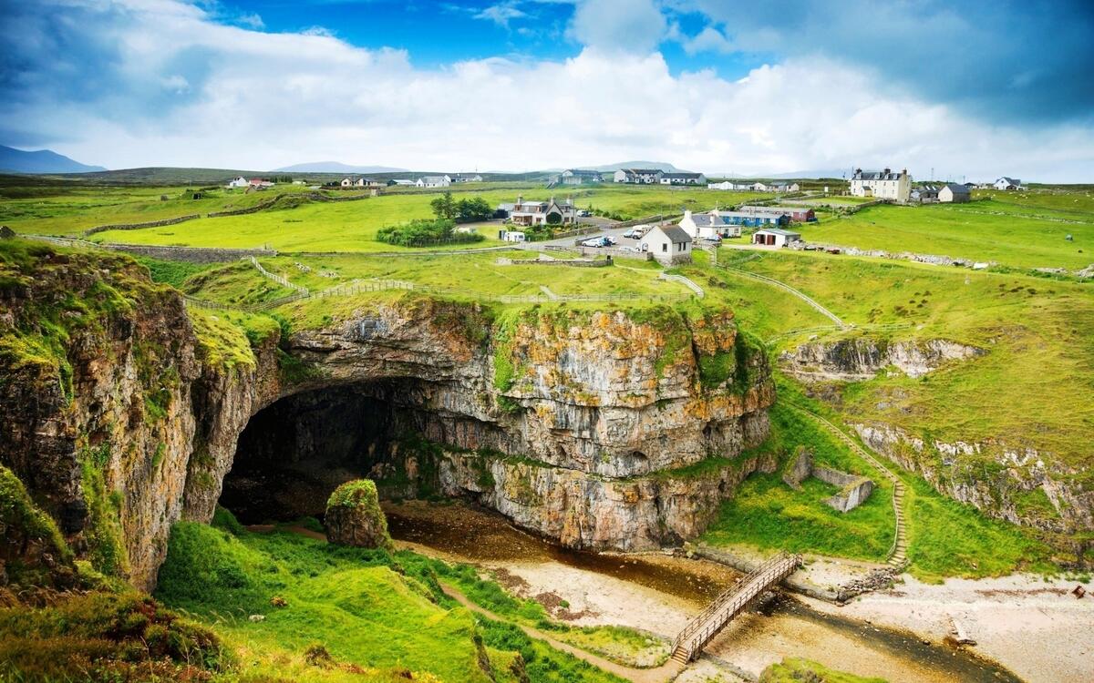 A large cave not far from a settlement in Scotland.