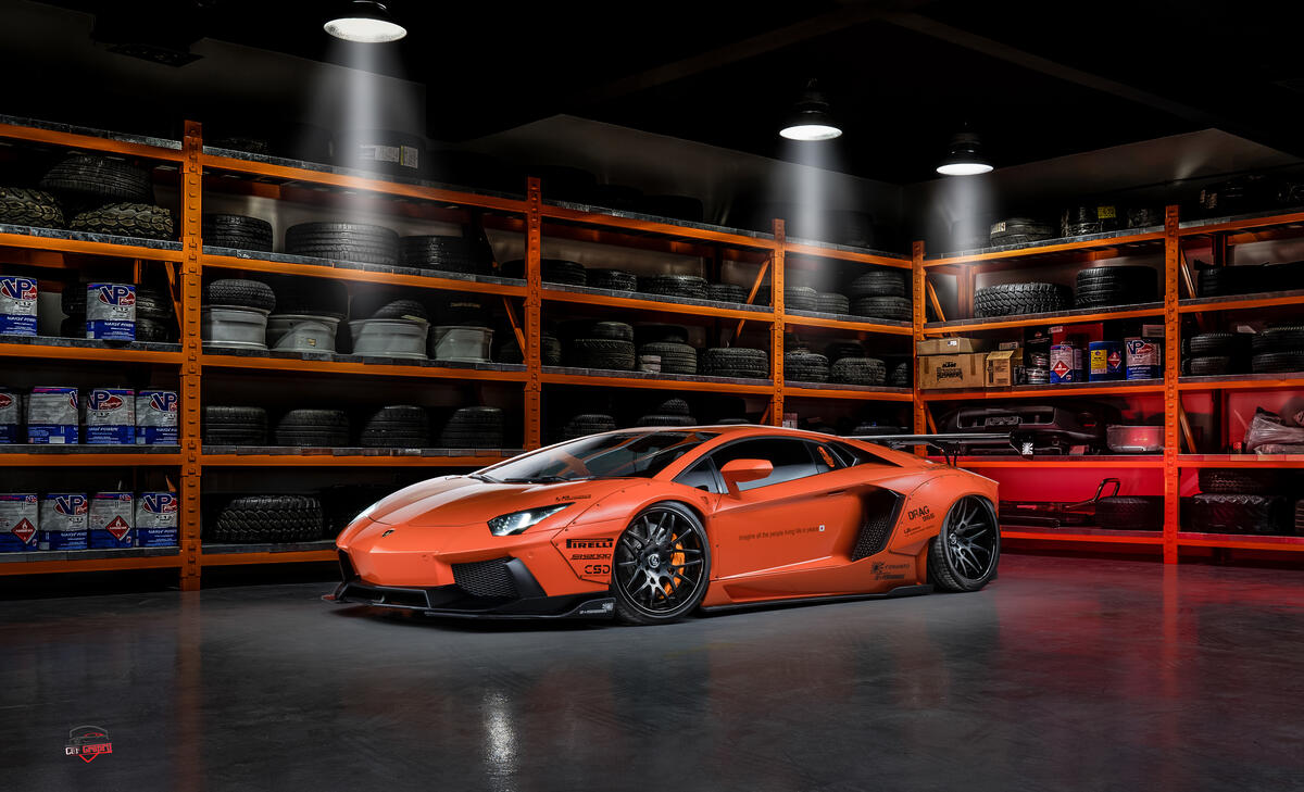 Оранжевая Lamborghini Huracan в большом гараже