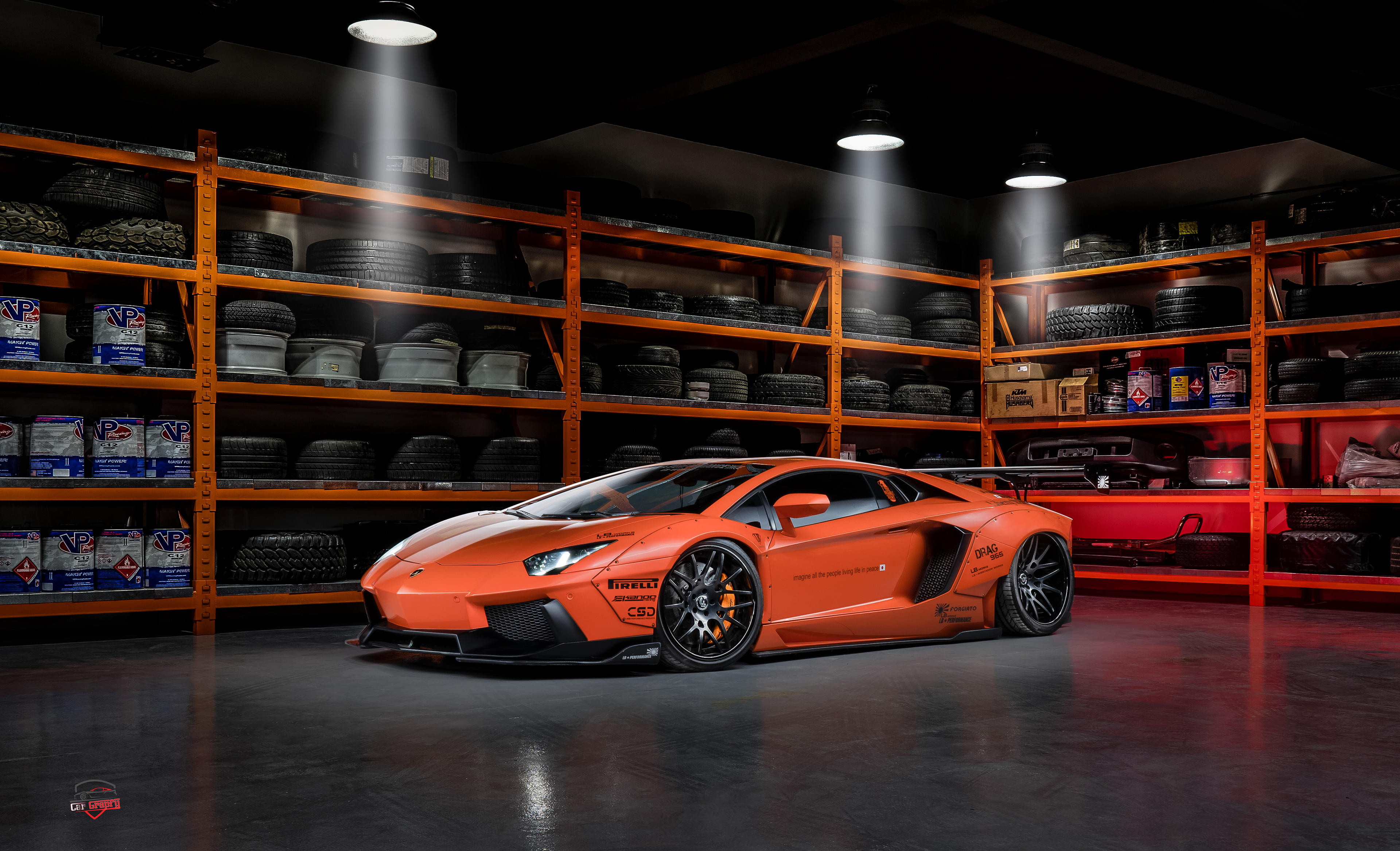 Free photo Orange Lamborghini Huracan in a big garage