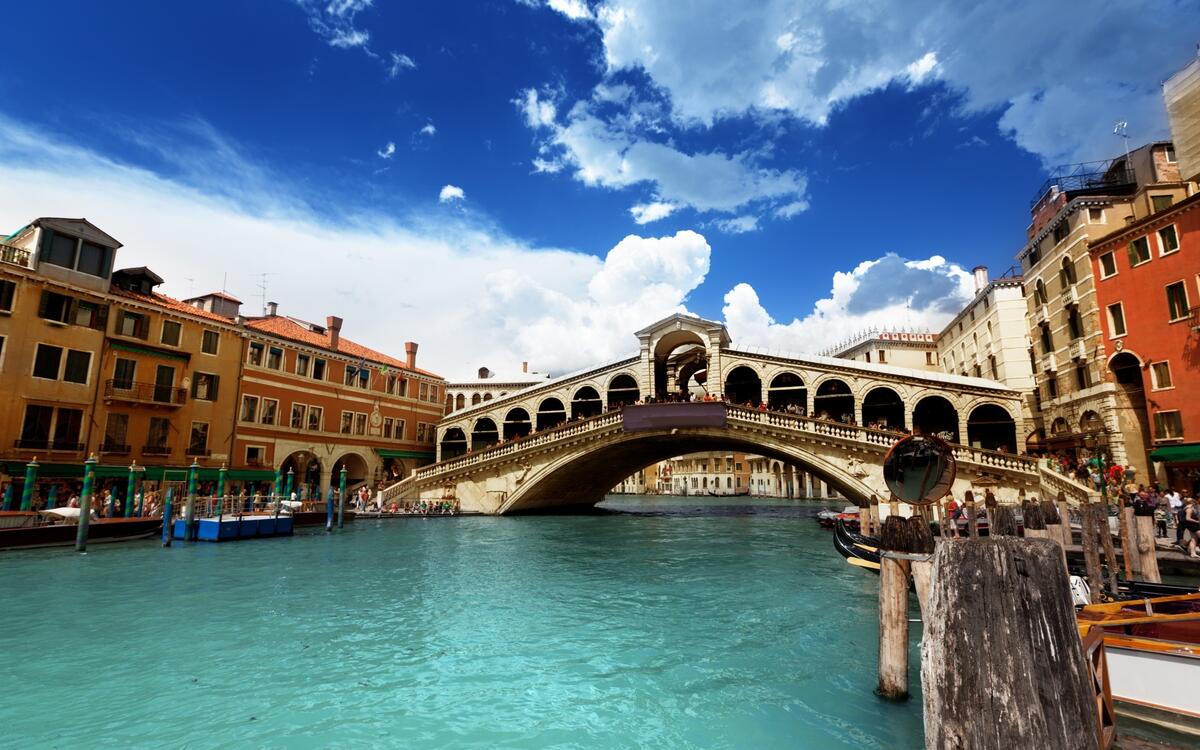 Bridge over the river with blue water in Venice