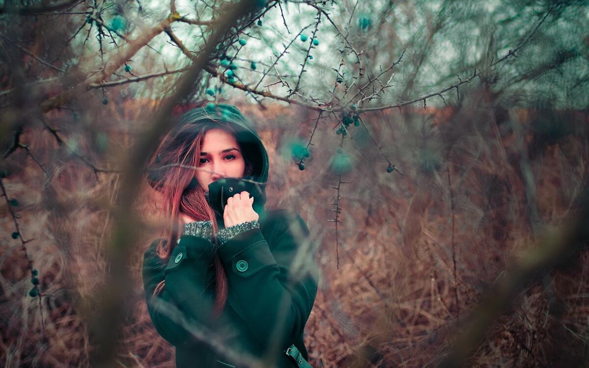 A girl at a photo shoot in the woods