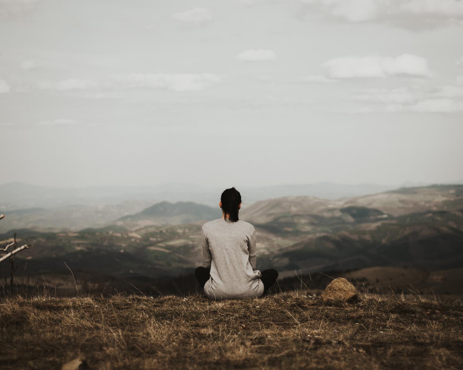 Free photo A girl meditates in nature