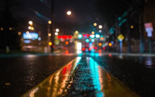 Wet asphalt at night