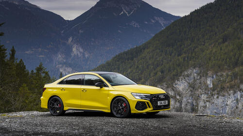Audi rs 3 in yellow in mountainous terrain