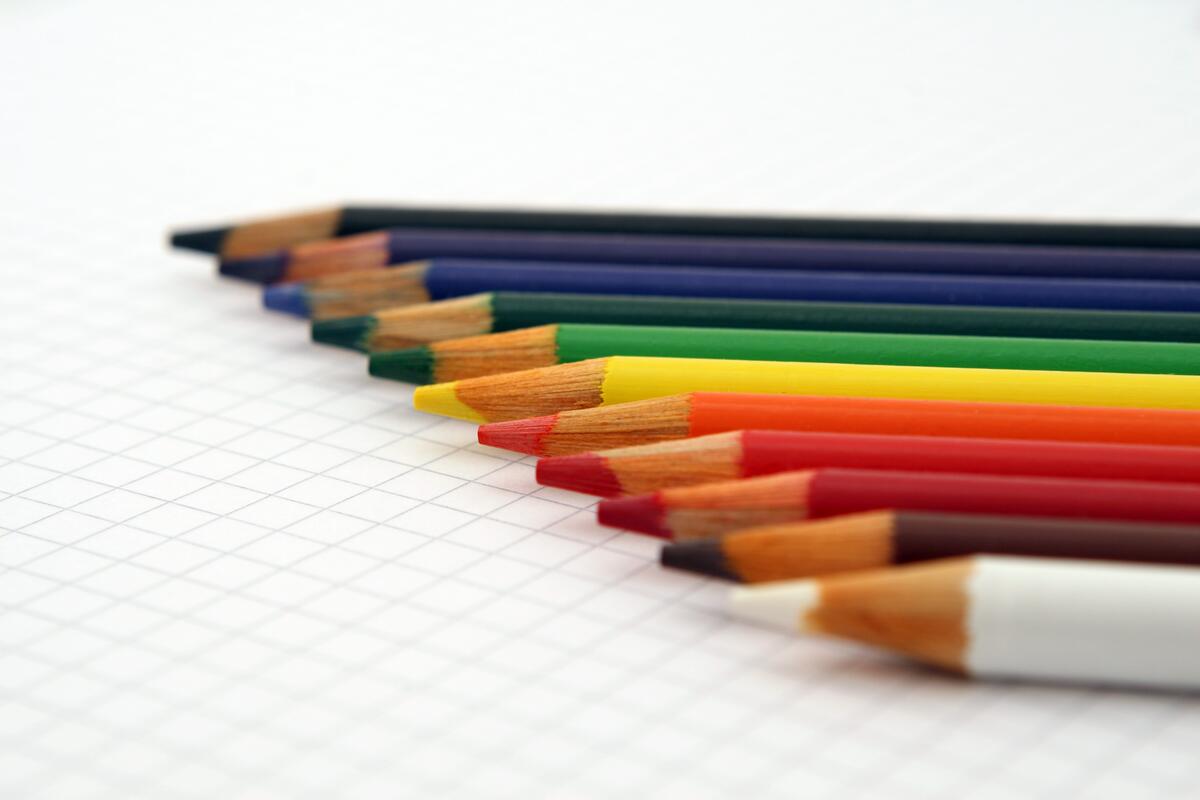 Colored pencils lined up in a line.