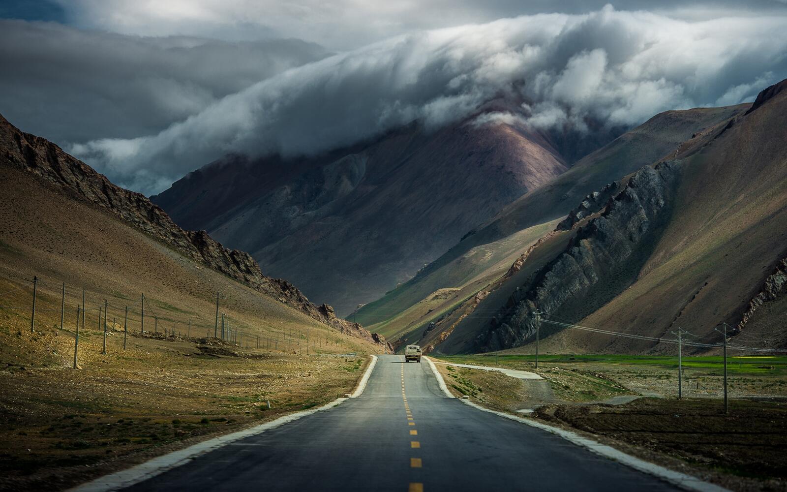Wallpapers wallpaper long road paved road mountains on the desktop