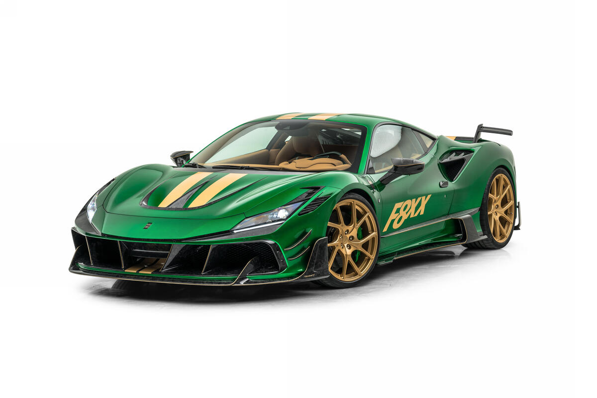 Green Ferrari with gold rims