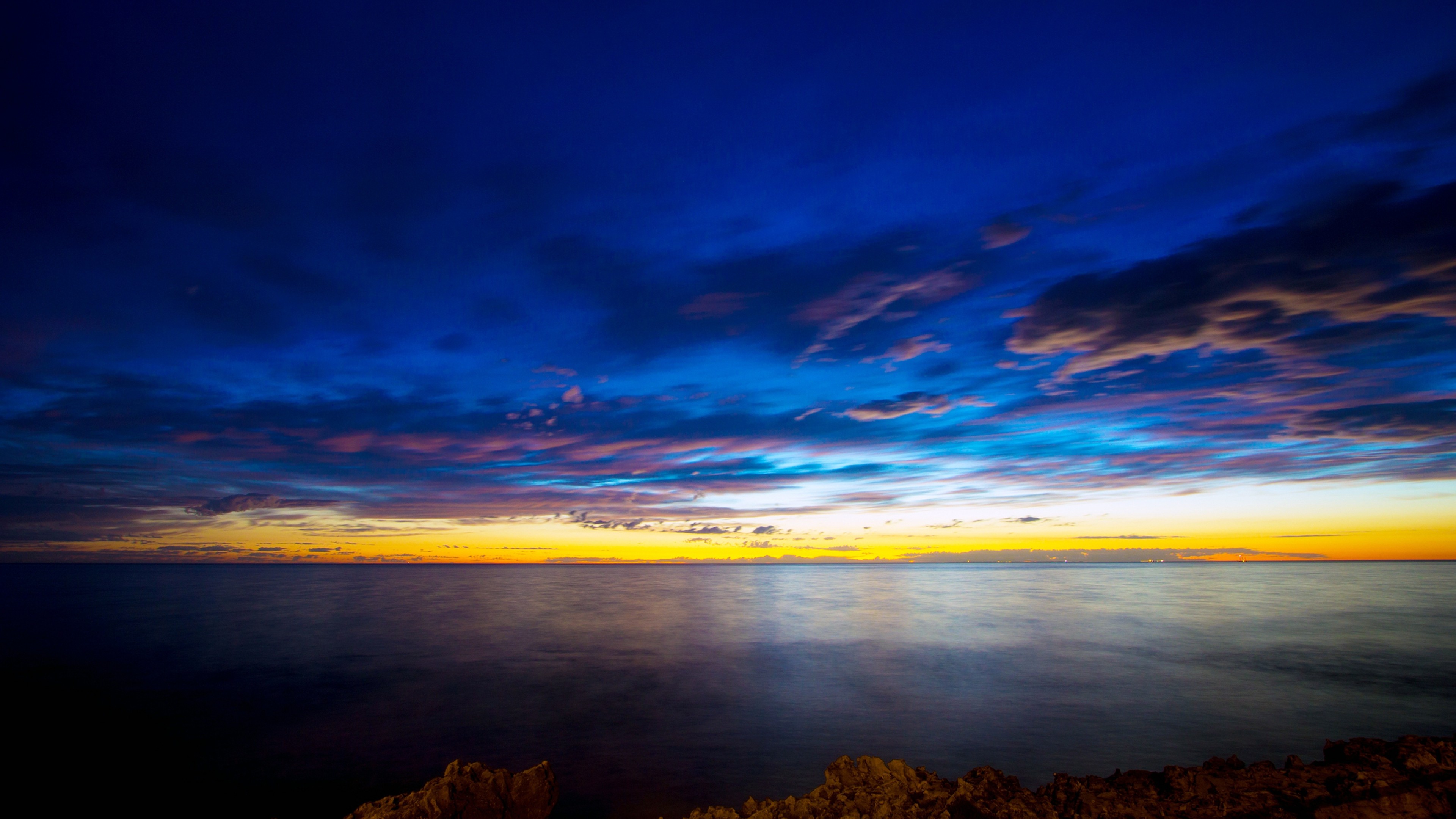 Бесплатное фото Закат солнце у горизонта моря