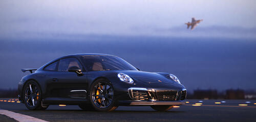 Черный Porsche на взлетной полосе