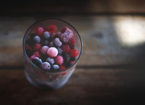 Frozen wild berries in a glass