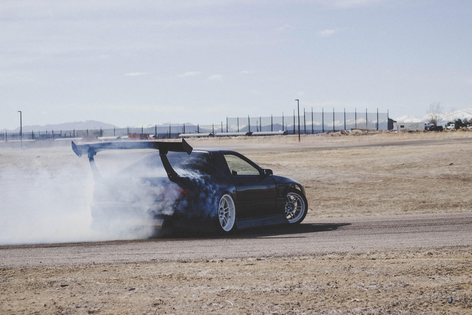 Free photo Drifting in a cool sports car.
