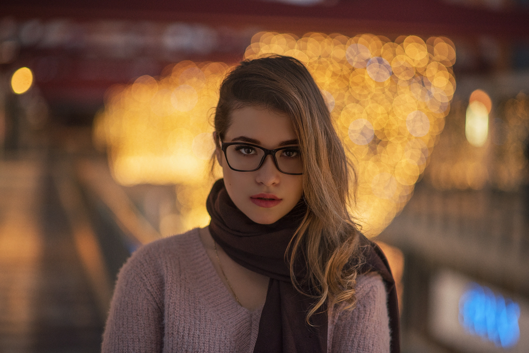 Portrait of a girl with glasses and a scarf
