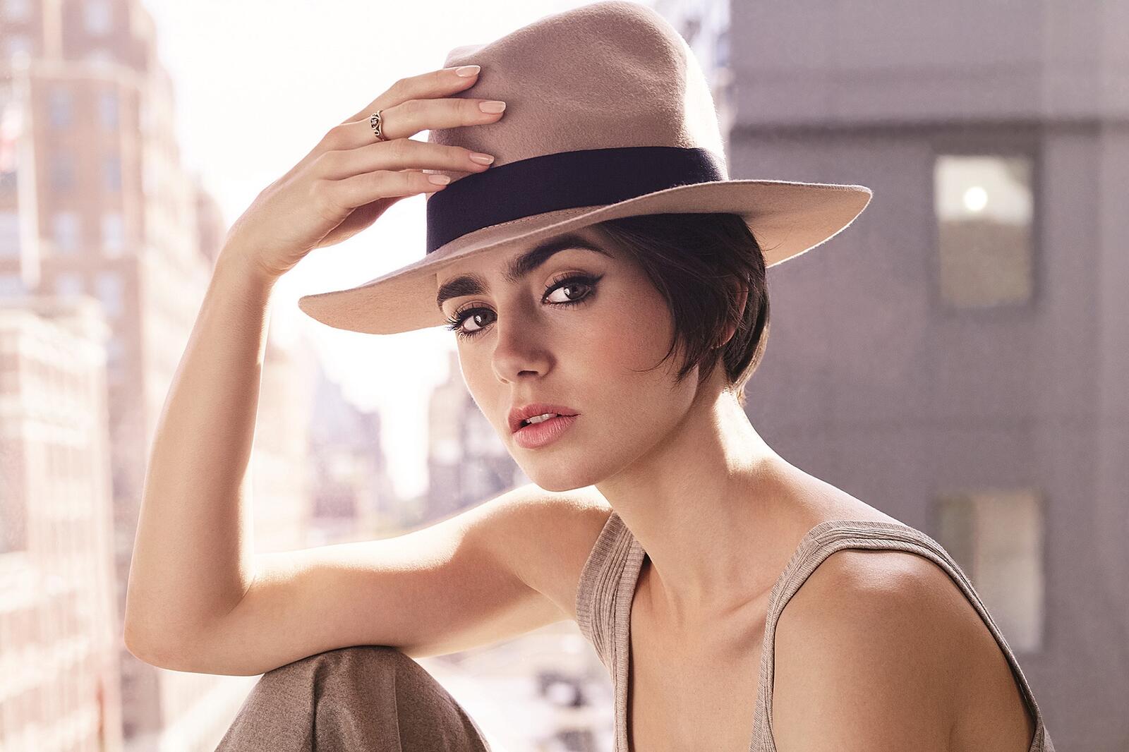 Free photo Lily Collins in a white hat.