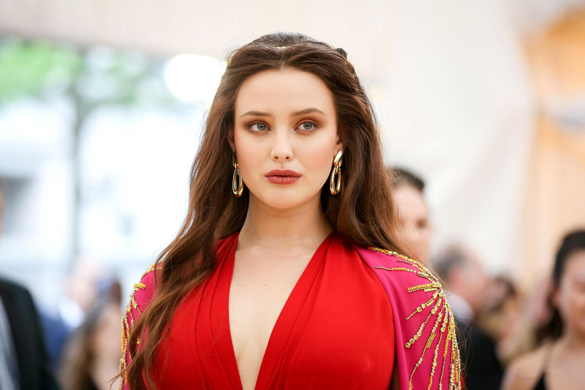 Katherine Langford in a red dress.