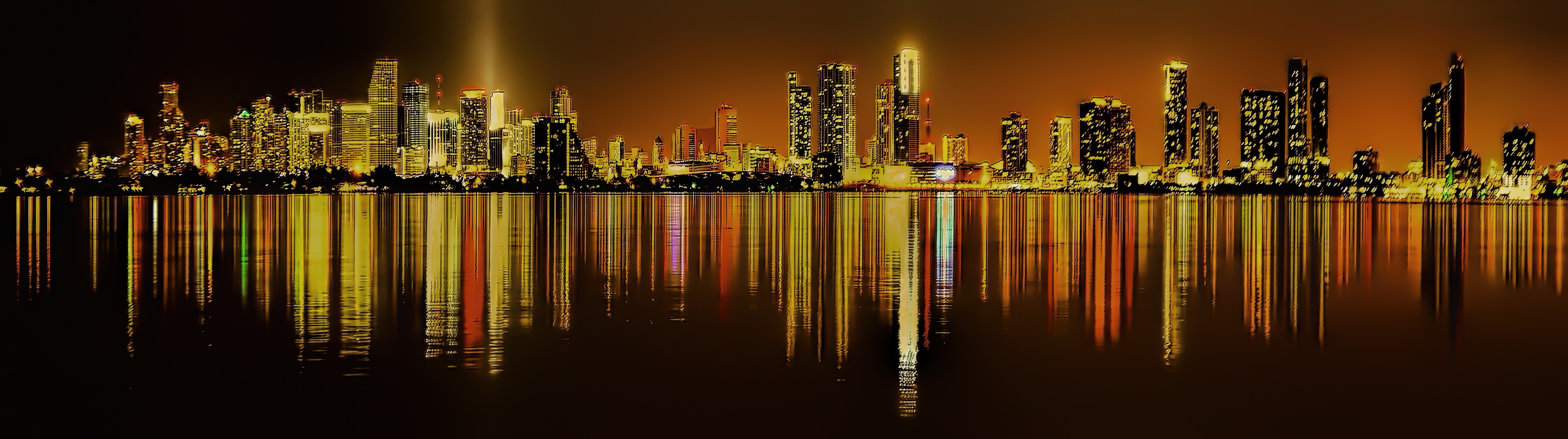 The night city of skyscrapers reflected in the water