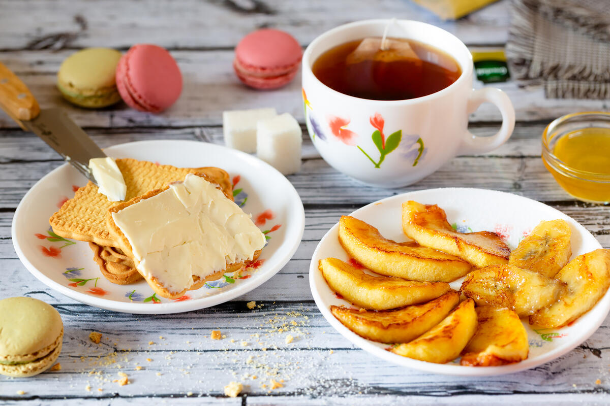 Tea with biscuits and fruits