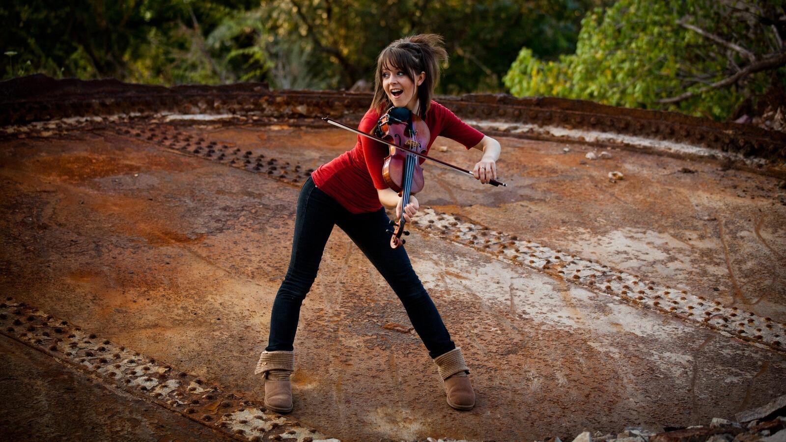 Free photo Lindsey Stirling plays the violin.