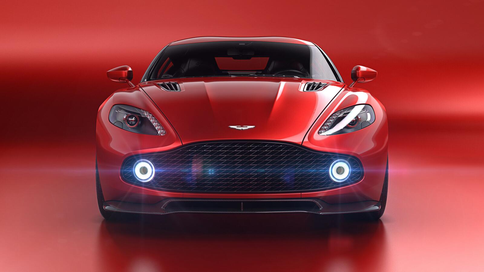 Бесплатное фото Красный Aston Martin на красном фоне