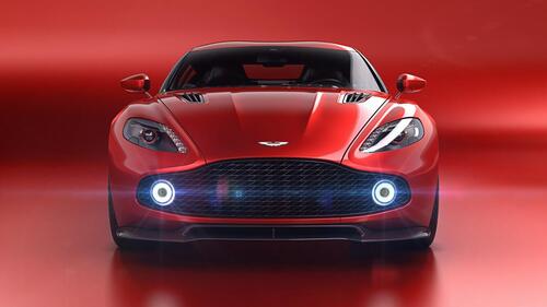 Красный Aston Martin на красном фоне