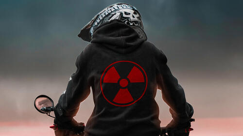 The radioactive sign on the biker`s jacket
