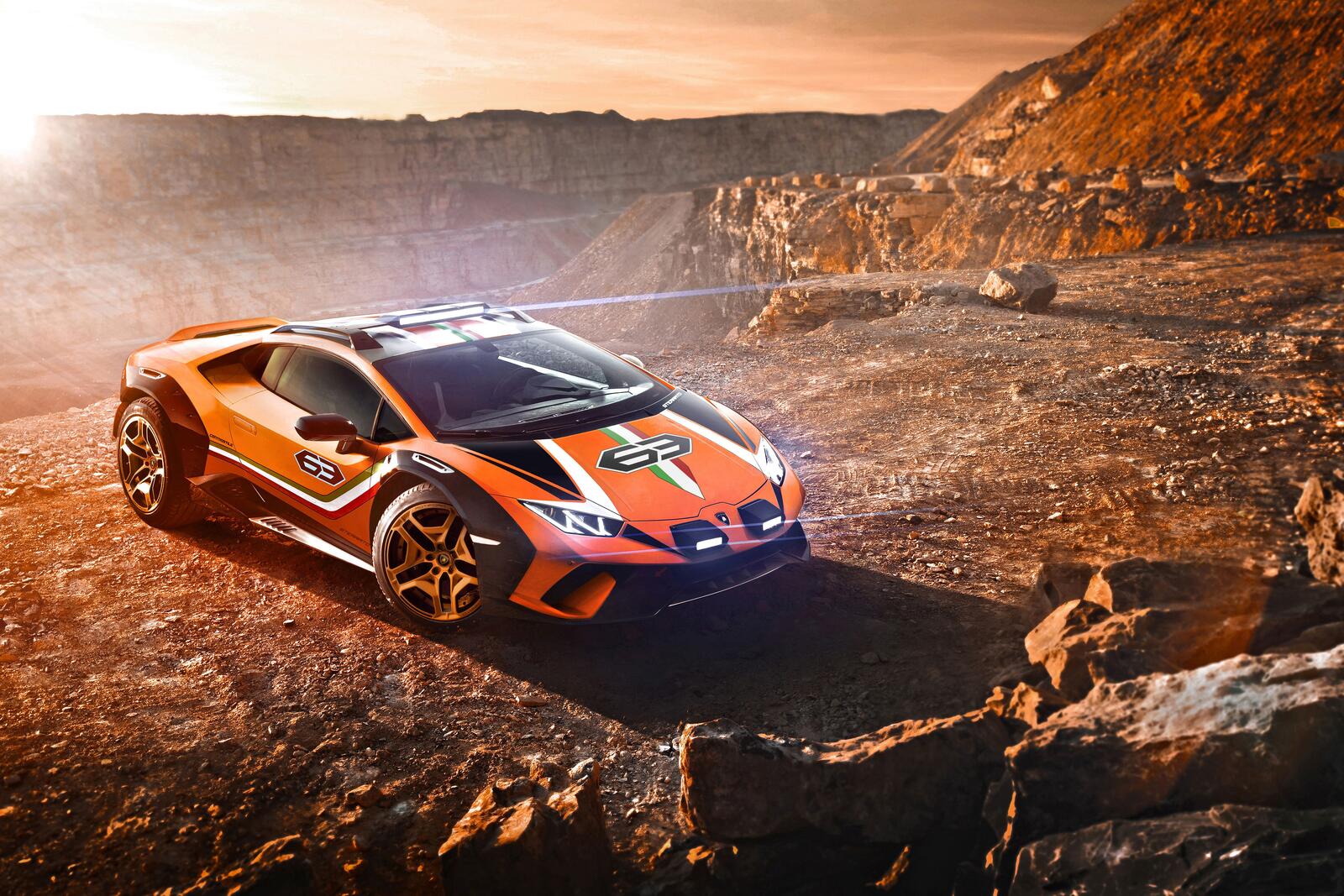 Free photo Picture of a lamborghini off-roading in a sandpit
