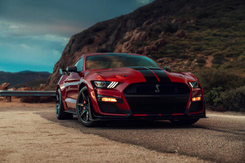 Red Ford Mustang with black stripes