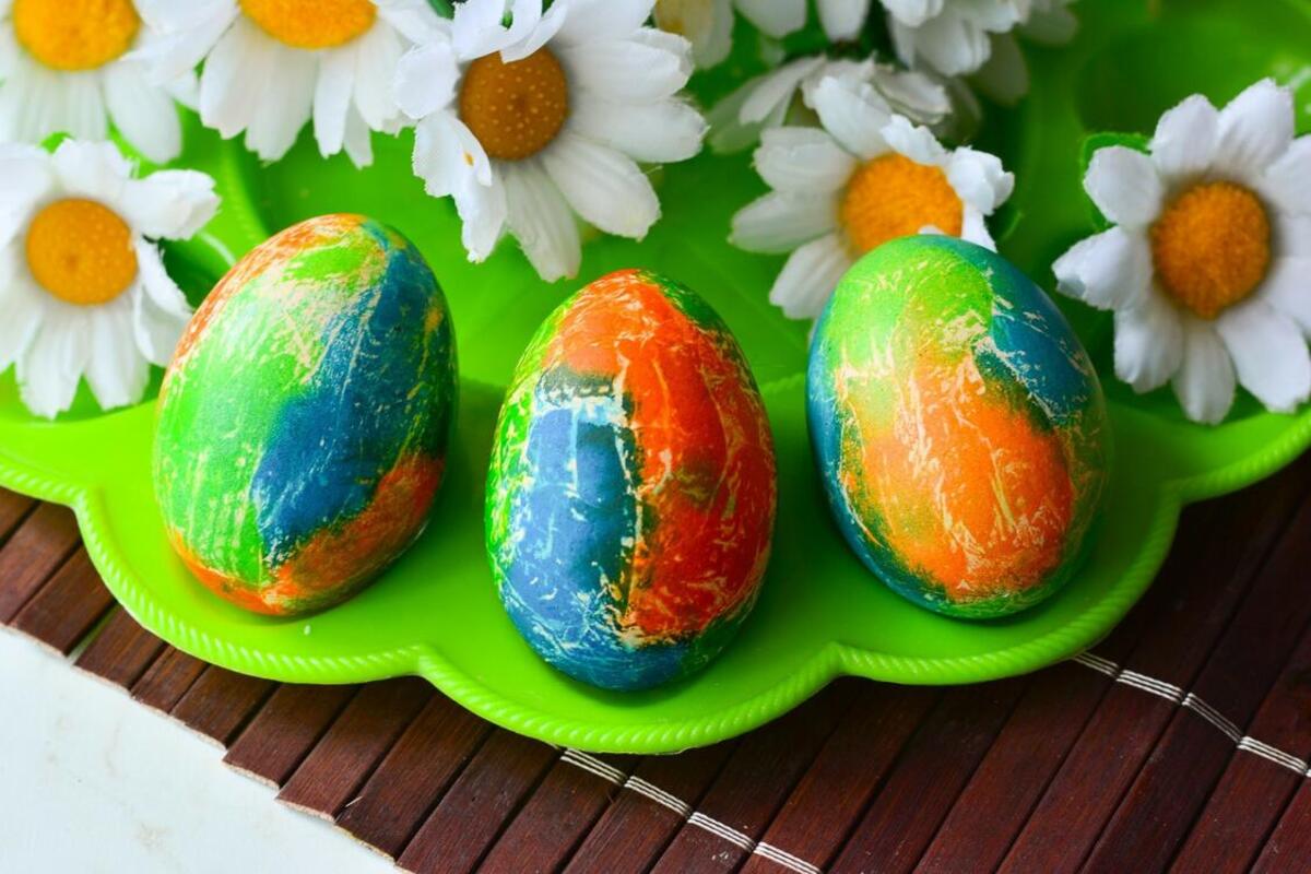 Colored eggs with daisies