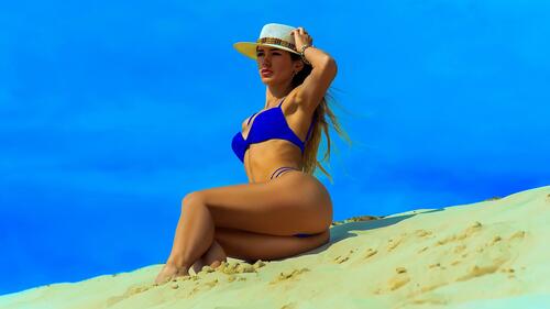 A girl sunbathing in a hat