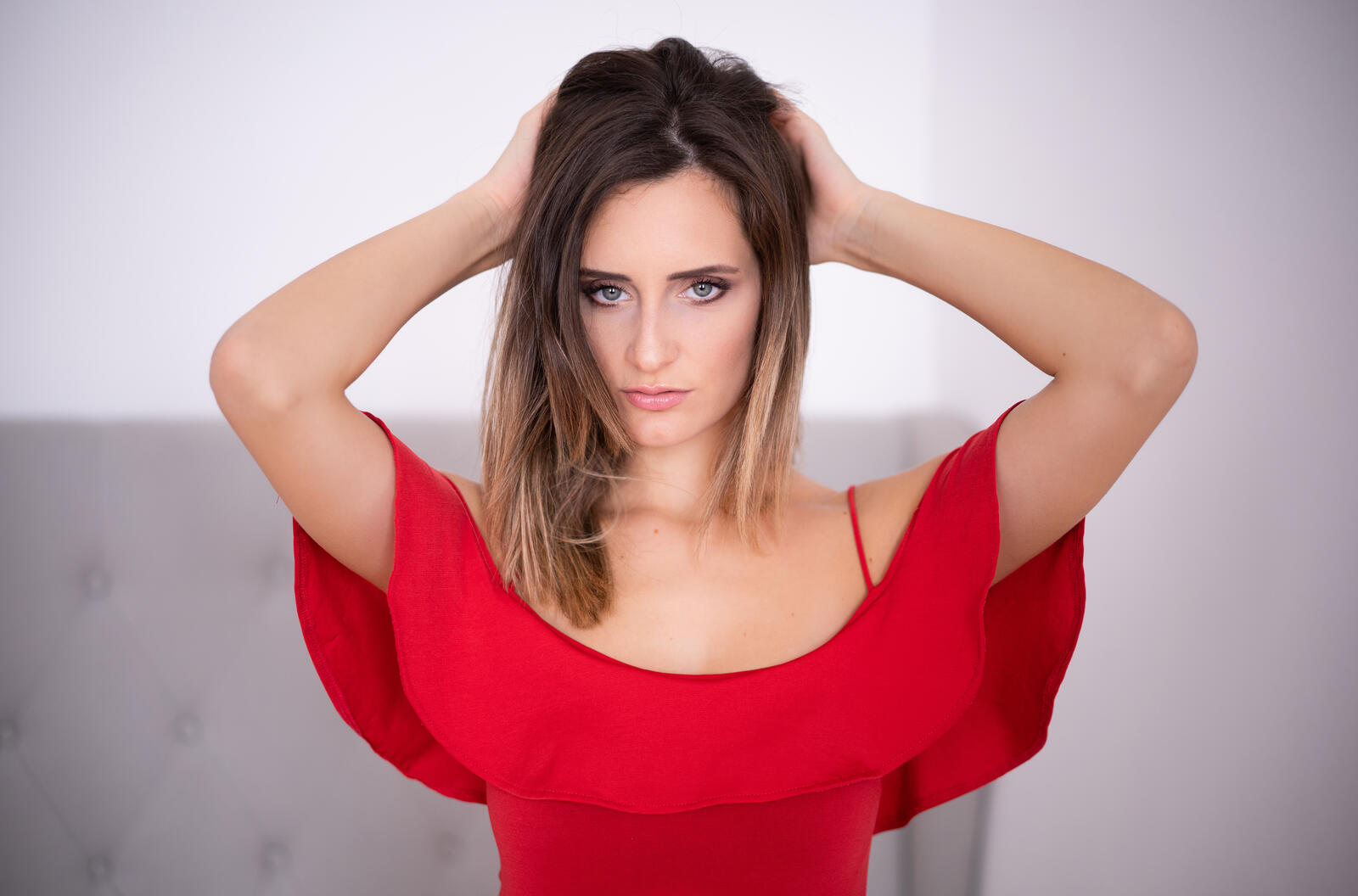 Free photo Young dark-haired girl in a red dress