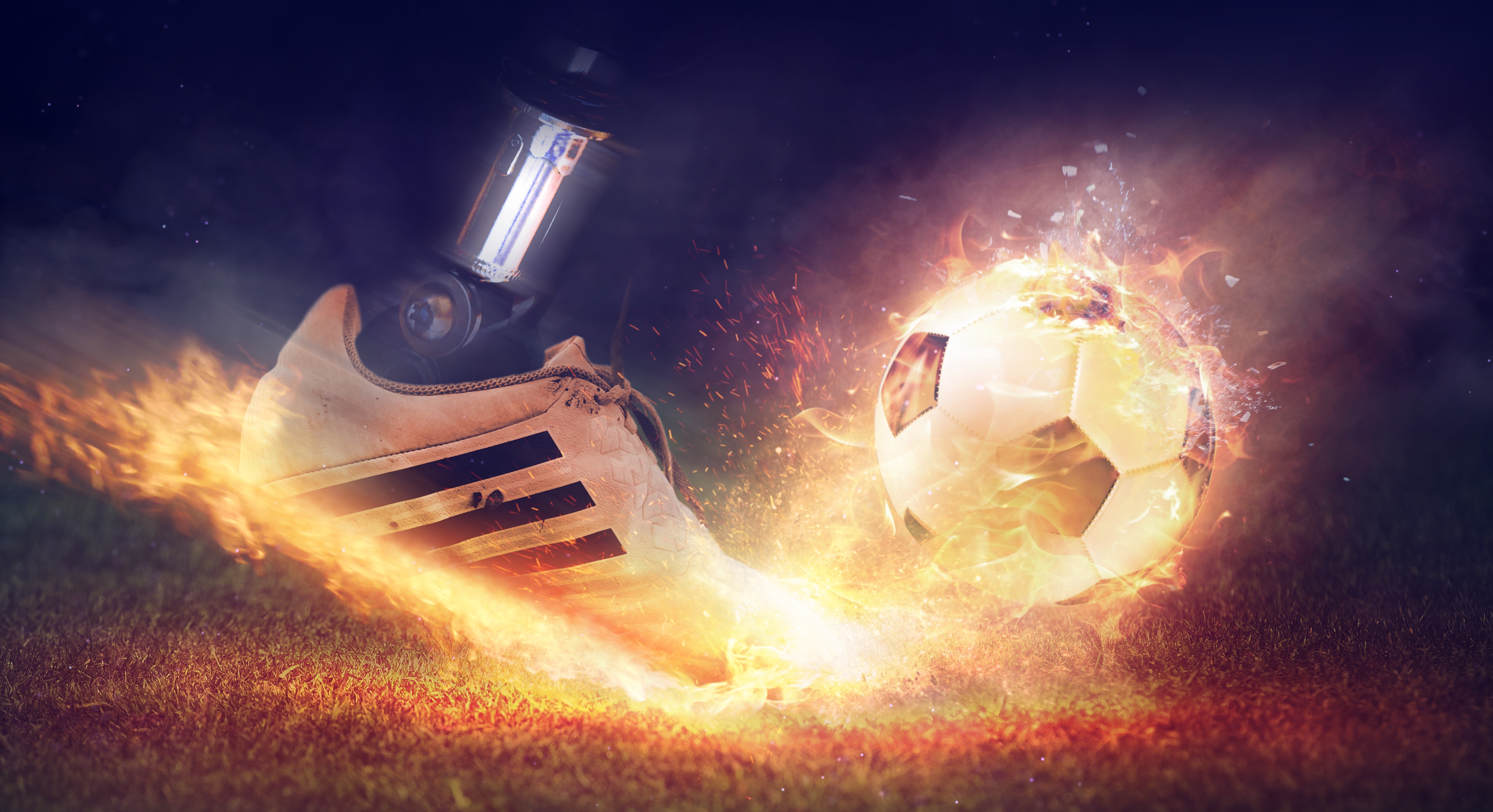 Бесплатное фото Нога робота пинает горящий мяч