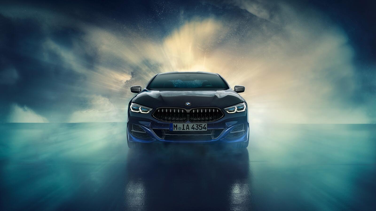 Free photo Bmw Individual M850i Xdrive Coupe Night Sky against a backdrop of smoke