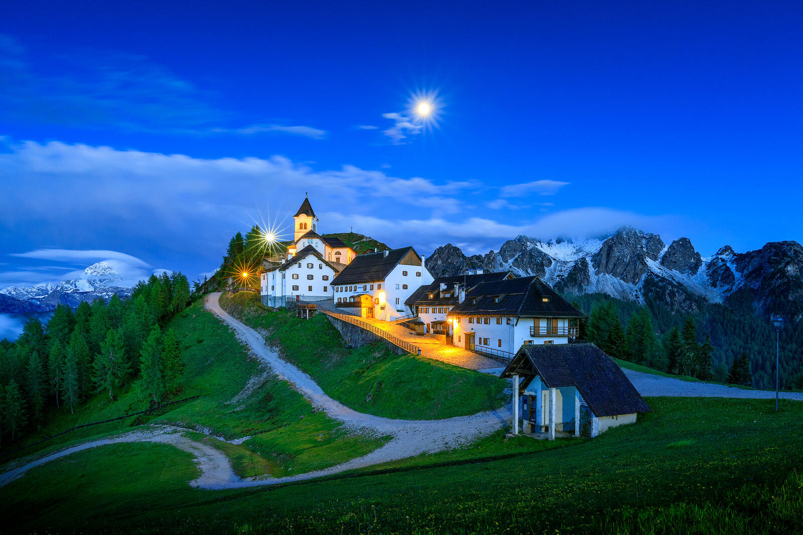 Wallpapers Moonrise over Monte Lussari Italy buildings on the desktop