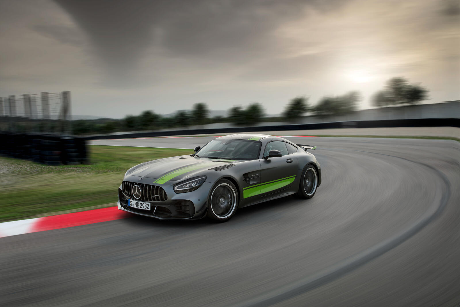 Free photo Mercedes AMG GTR drives on a sports track.