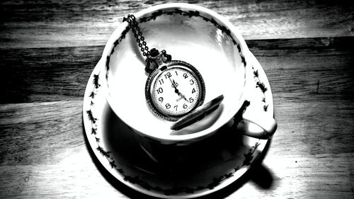 The pocket watch lies in the bowl