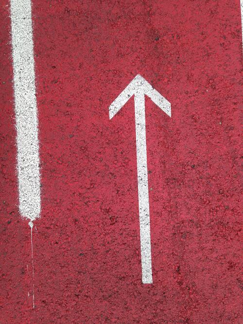The red arrow on the pavement