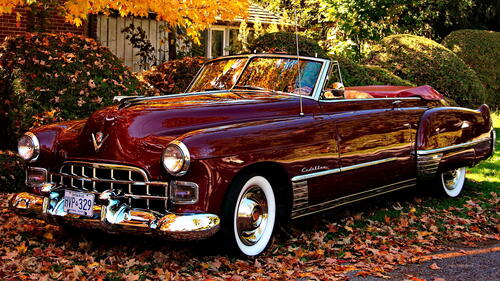 A vintage Cadillac convertible in red