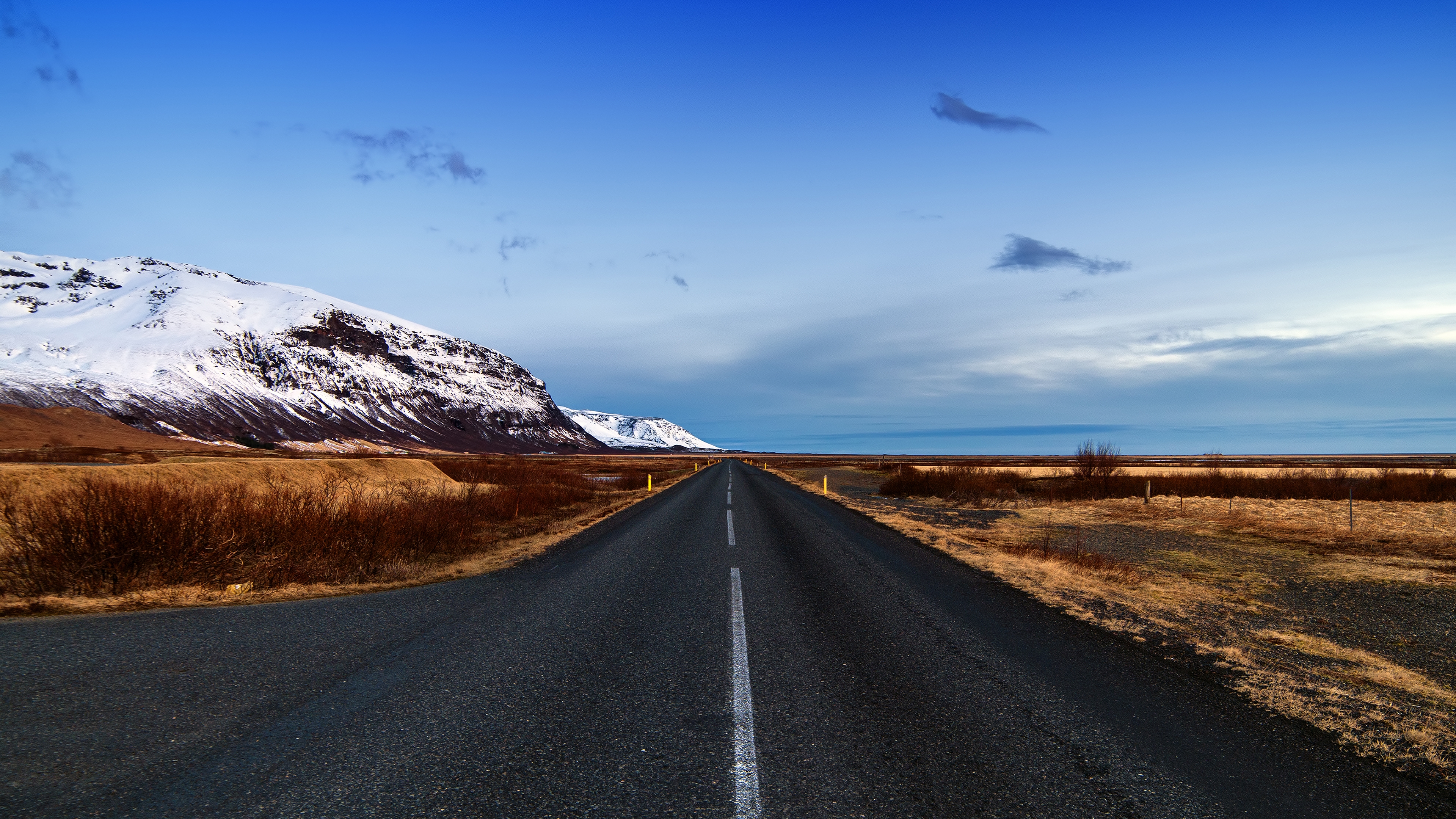 Обои Исландия длинная дорога снег на рабочий стол