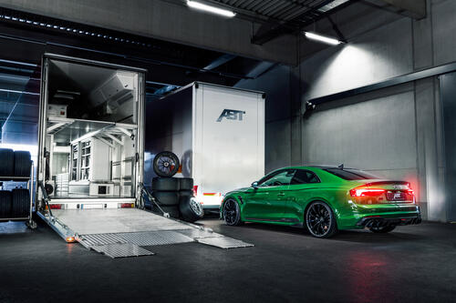 Green Audi Abt Rs5 R at the tire shop.